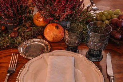 Various fruits in glass container on table