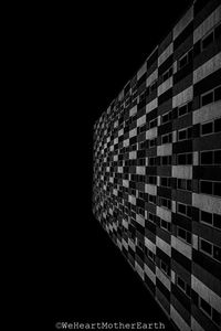 Low angle view of illuminated building against sky at night