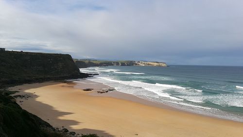 Scenic view of beach against sky