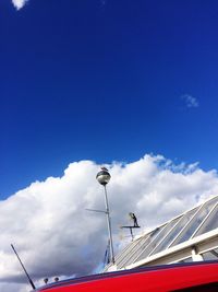 Low angle view of snow against blue sky