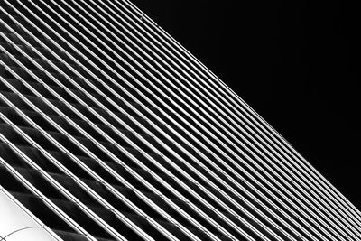 Low angle view of modern building against sky at night