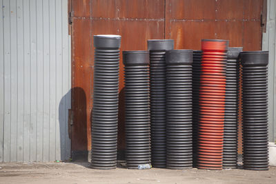 Plastic pipes for sewerage on street. ribbed pipes in stock. sewerage system. industrial facilities.