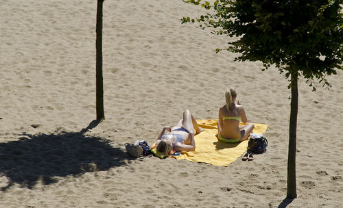 High angle view of people sitting on beach