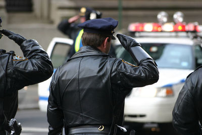 Rear view of police officers