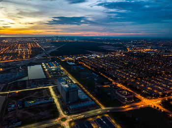 Aerial view of cityscape during sunset