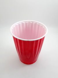 Close-up of red drink against white background