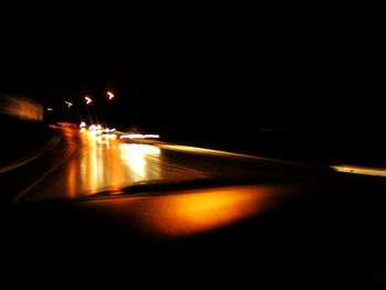 Car moving on road at night