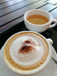 High angle view of cappuccino on table