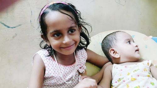 Portrait of cute girl with mother and daughter