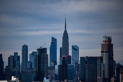 Modern buildings in city against sky