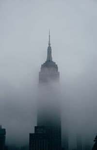 View of skyscrapers in foggy weather