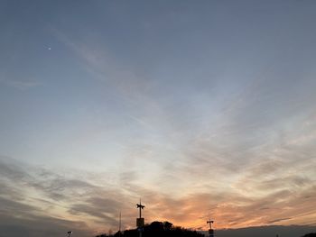 Low angle view of silhouette buildings against sky during sunset