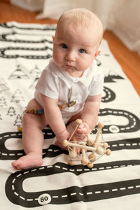 Portrait of cute baby playing at home