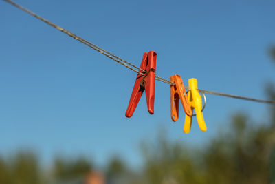 Colorful clothespin clothespins on the hangers. plastic clothespins in different colors.