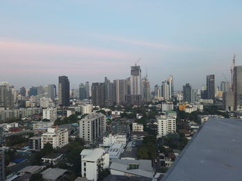 High angle view of buildings in city against sky