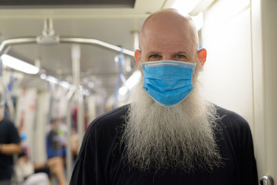 Close-up portrait of man wearing mask