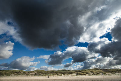 Scenic view of landscape against blue sky