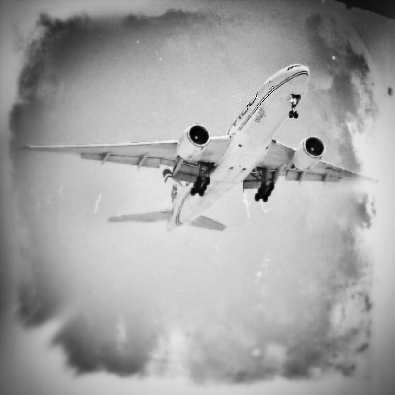 airplane, air vehicle, transportation, mode of transport, indoors, flying, auto post production filter, mid-air, transfer print, low angle view, day, no people, sky, close-up, built structure, selective focus, vignette, travel, reflection