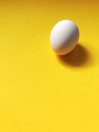 High angle view of ball on yellow background