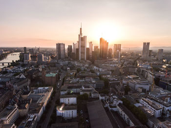 High angle view of city buildings during sunset