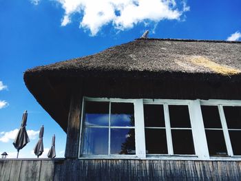 Low angle view of residential structure against sky