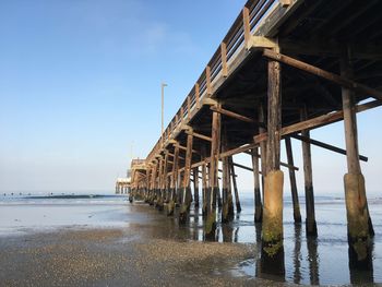 Pier over sea against sky