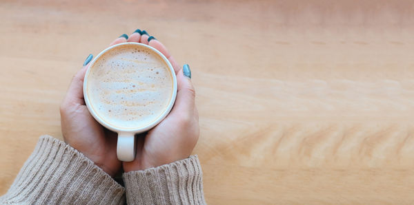 Close-up of coffee cup on table