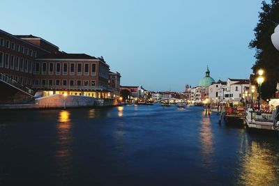 View of buildings in city at dusk