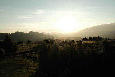 Scenic view of landscape against sky during sunset