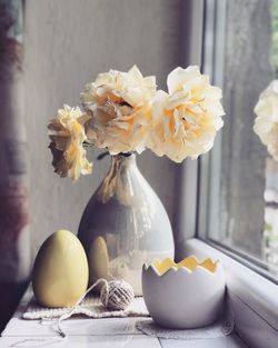 Close-up of yellow flowers in vase