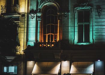 Low angle view of illuminated building at night