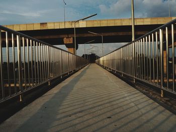 View of man walking on bridge