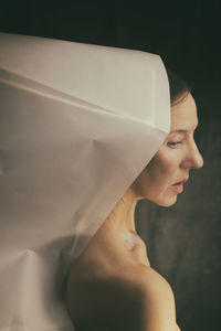 Woman in white paper hood iii