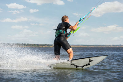 Full length of man on sea against sky