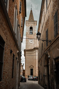 Low angle view of buildings and street in city