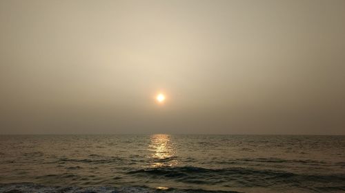 Scenic view of sea against sky at sunset