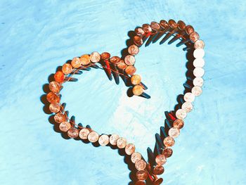 Nails forming heart shape on table