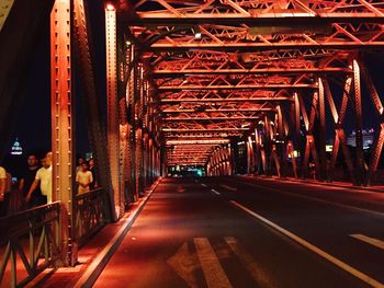 Empty road along trees