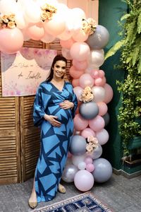 Portrait of a smiling young woman with balloons