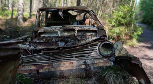 Abandoned car in forest