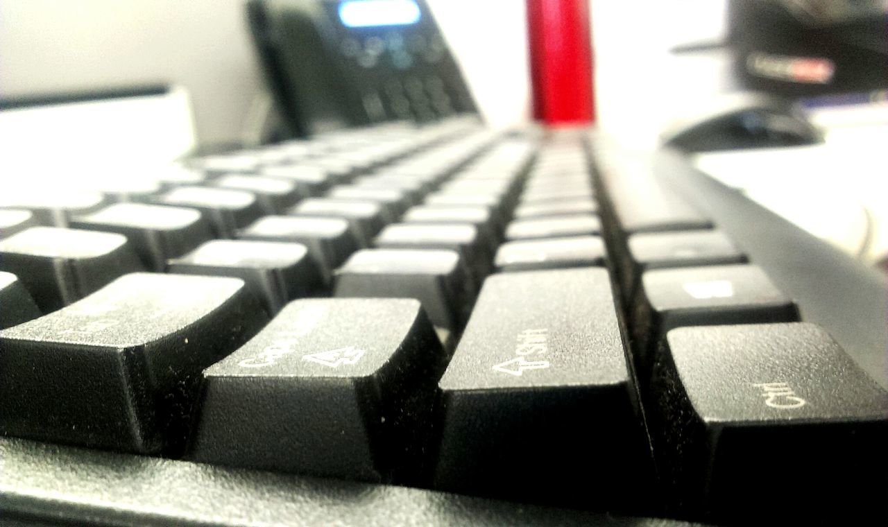 indoors, selective focus, in a row, piano key, piano, music, absence, close-up, arts culture and entertainment, empty, focus on foreground, technology, no people, musical instrument, table, surface level, desk, laptop, home interior, repetition