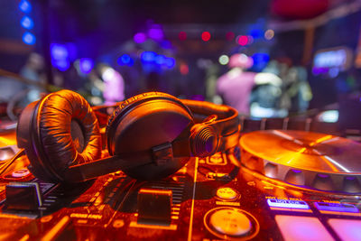 Close-up of illuminated lighting equipment on table