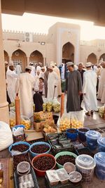 Rear view of people at market