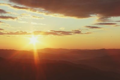 Scenic view of landscape against sky during sunset