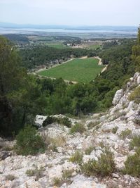 Scenic view of landscape and sea against sky