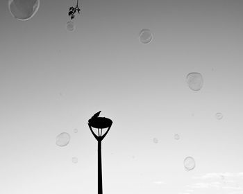 Low angle view of bubbles against water