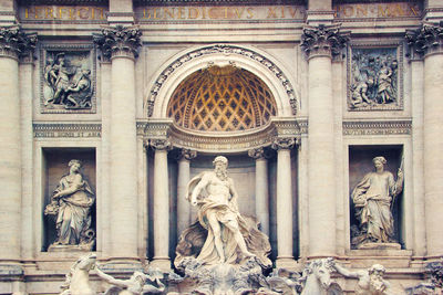 Statues in front of historical building