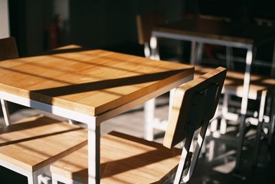Empty wooden table and chairs