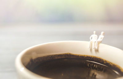 Close-up of coffee cup on table