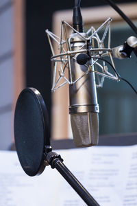 Close-up of microphone with soundproof in recording studio